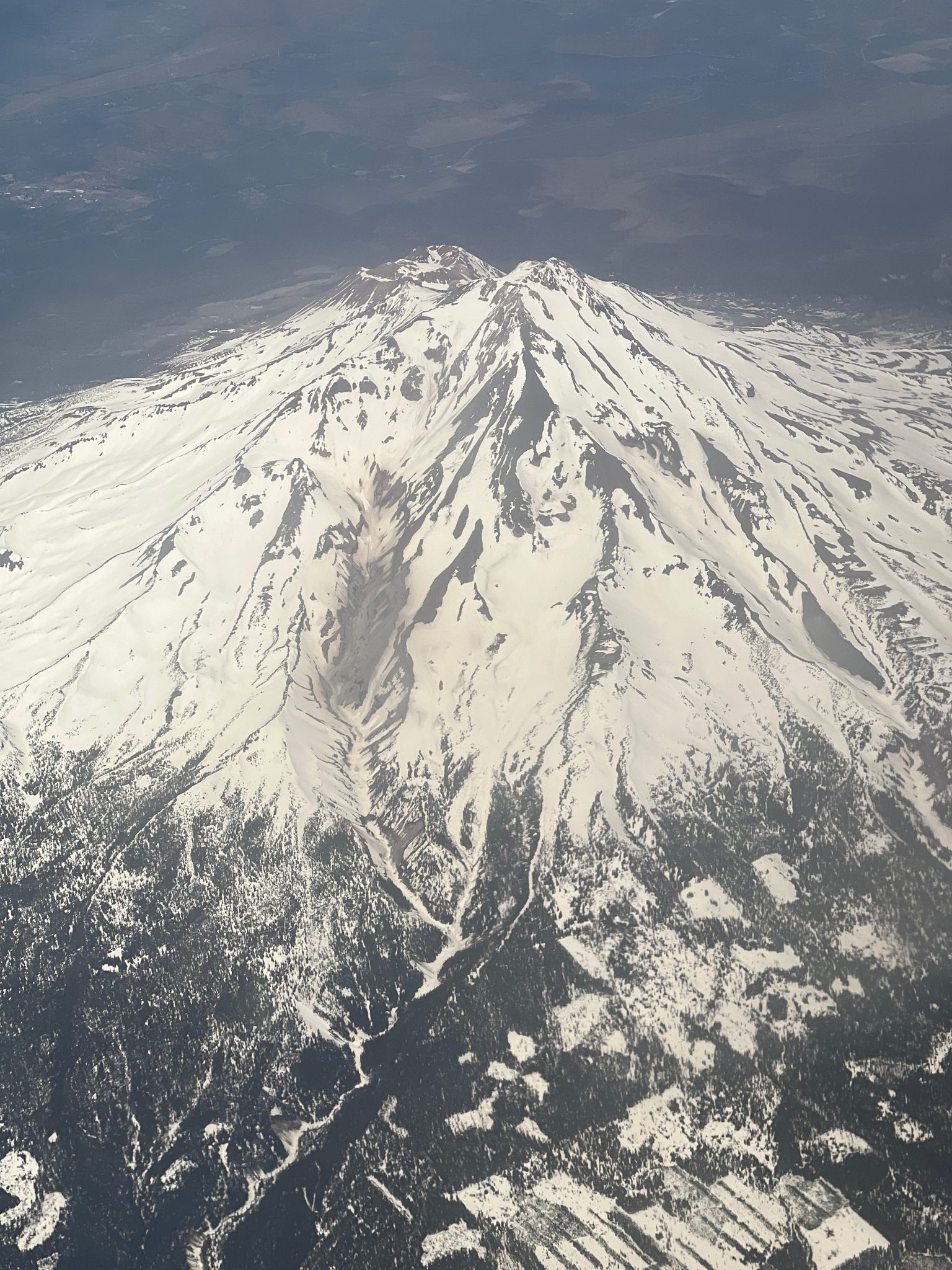 A snow-covered Cascade peak seen from the plane on the descent into Central Oregon