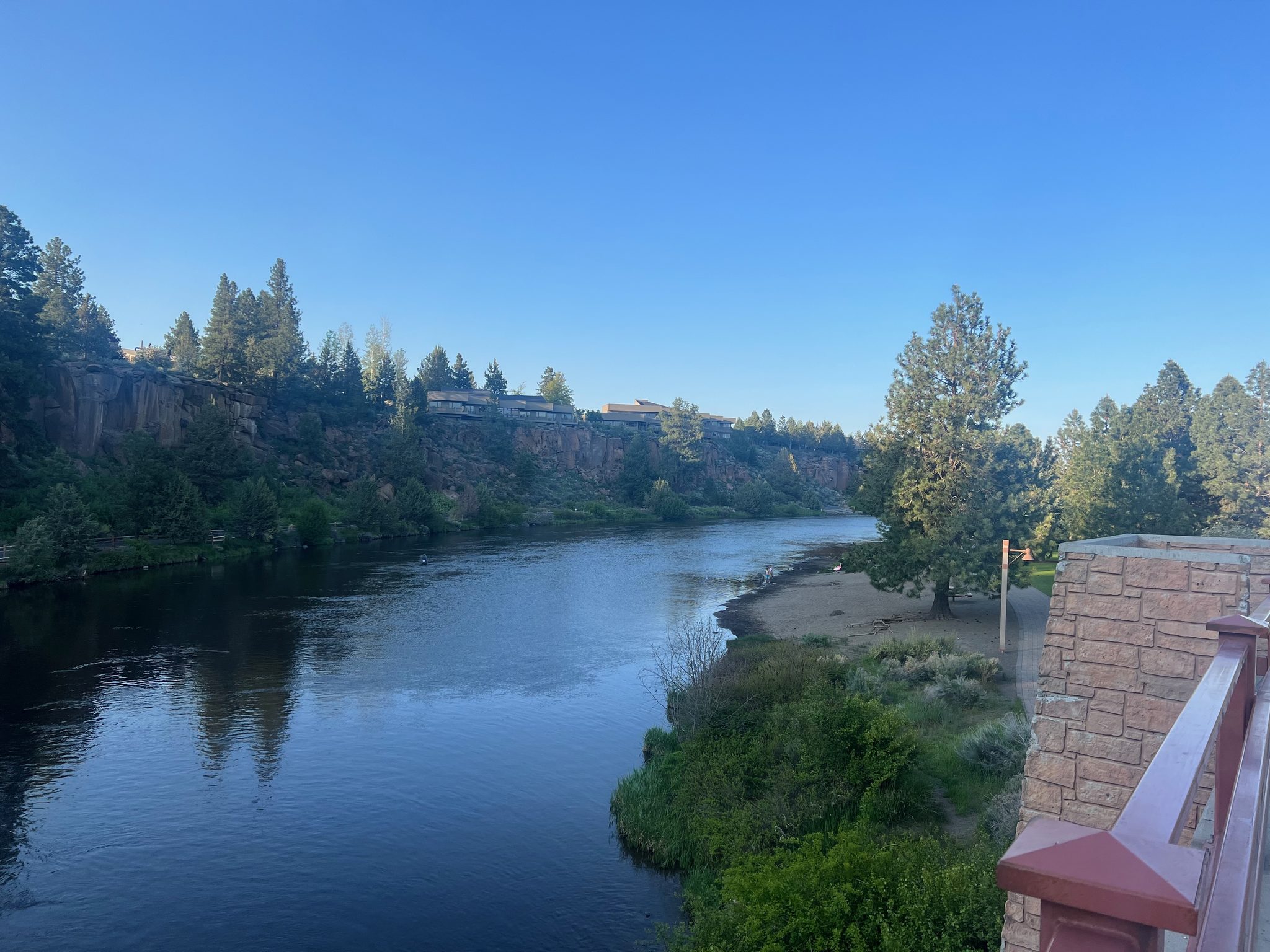 The Deschutes River winding past basalt cliffs in the evening light
