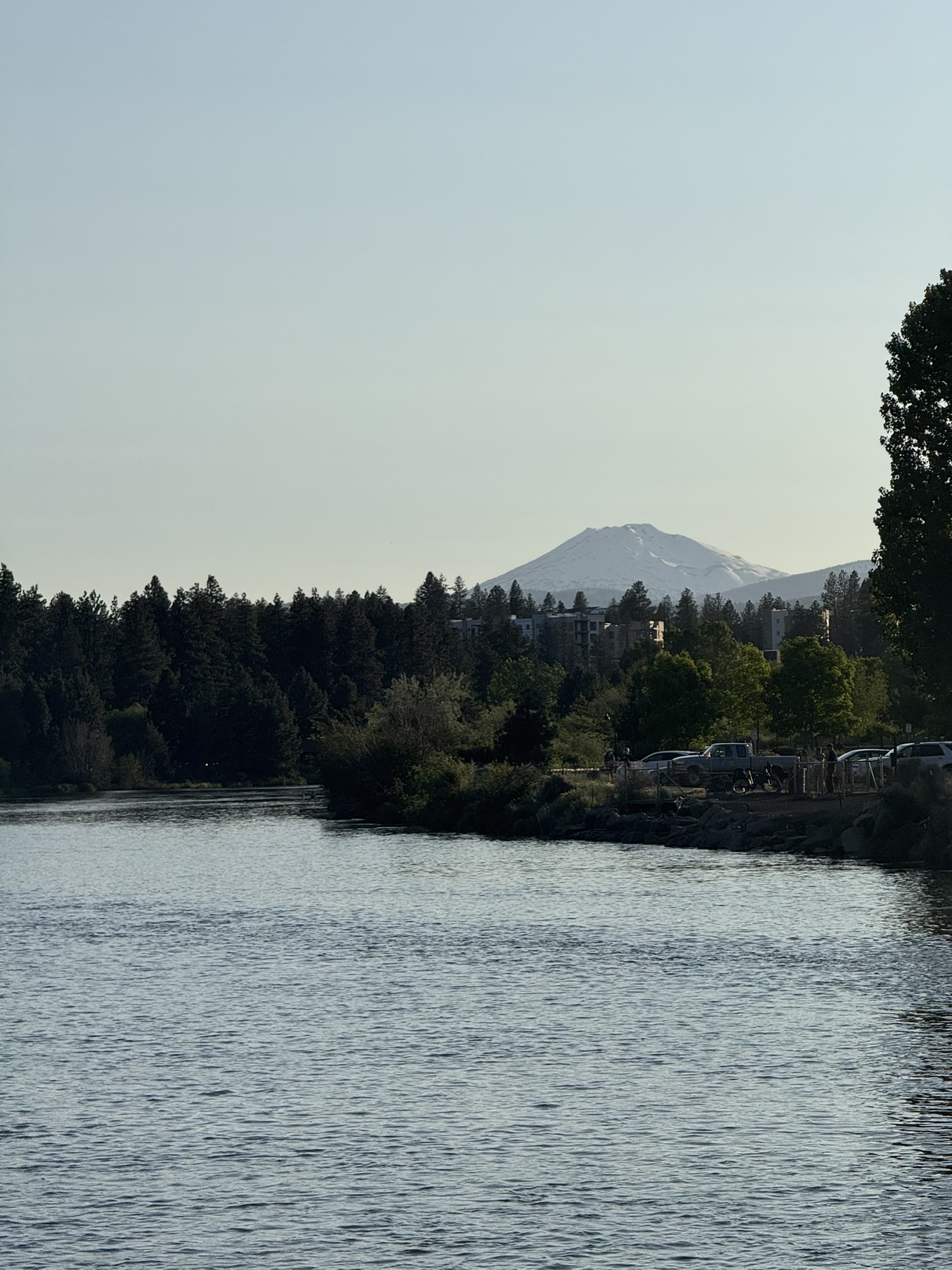 Mount Bachelor visible over the Deschutes River in the early evening