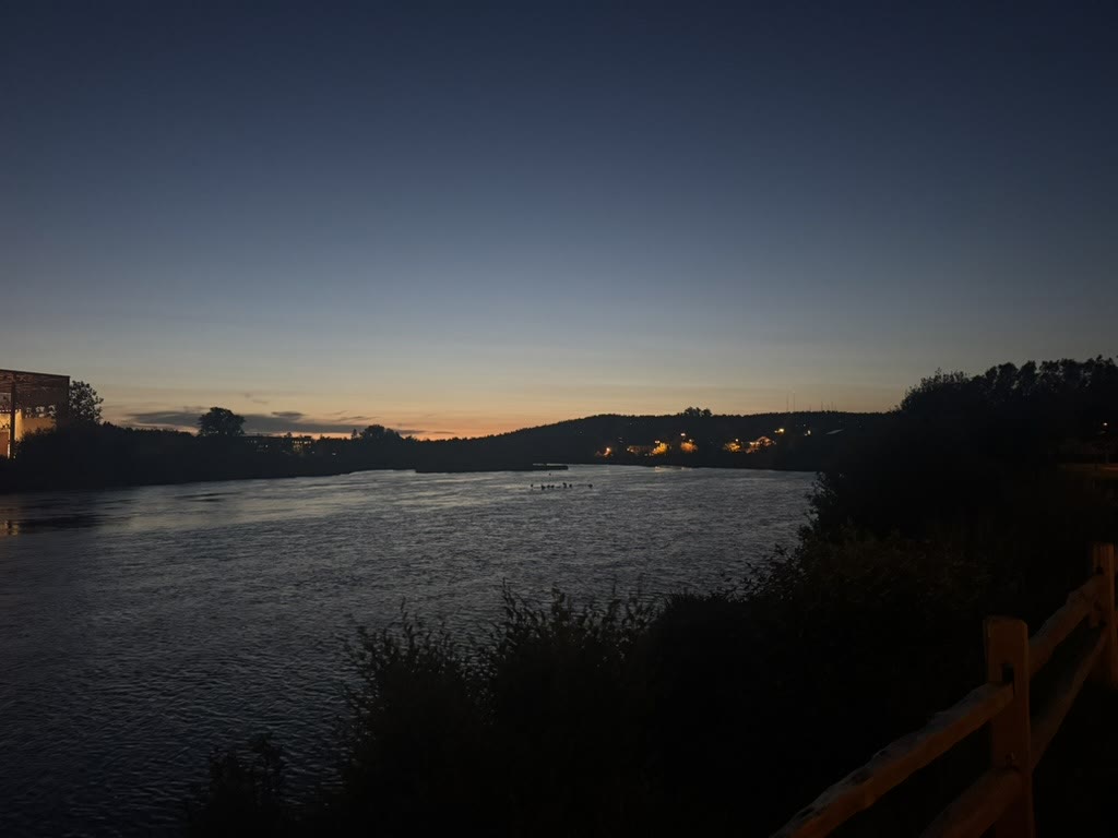 Deschutes River at dusk with the last light fading behind a hill