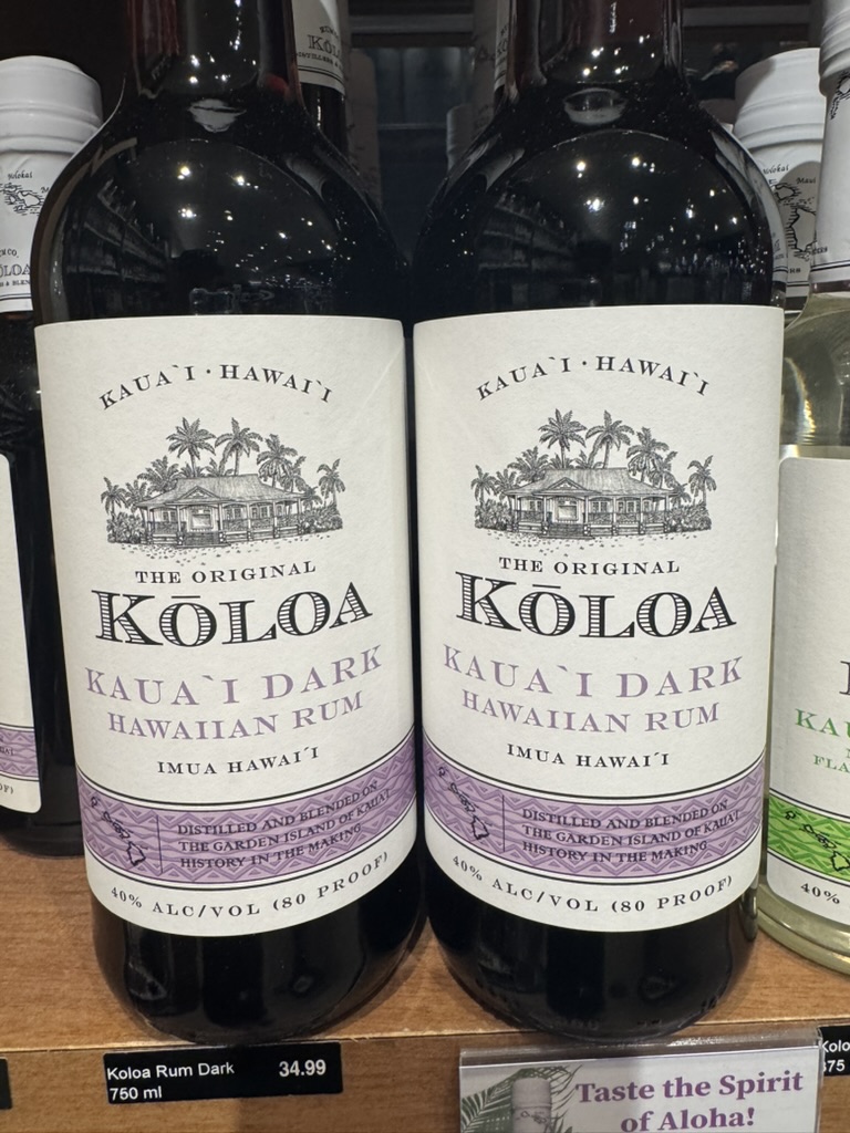 Bottles of Kōloa Kauaʻi Dark Hawaiian rum on a shelf