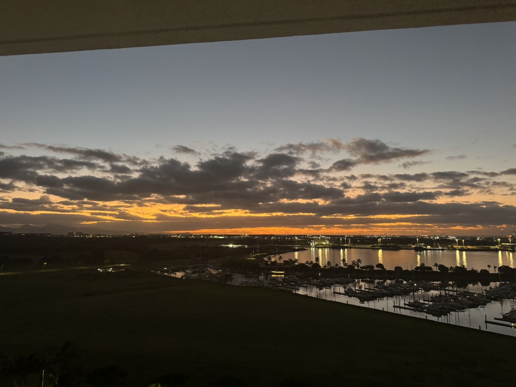 Marina sunset framed by the balcony overhang