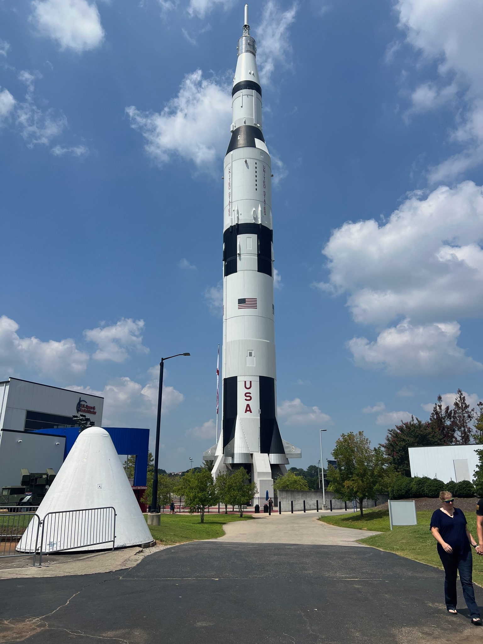 The full-scale Saturn V replica standing outside the U.S. Space & Rocket Center, an Apollo capsule mockup at its base