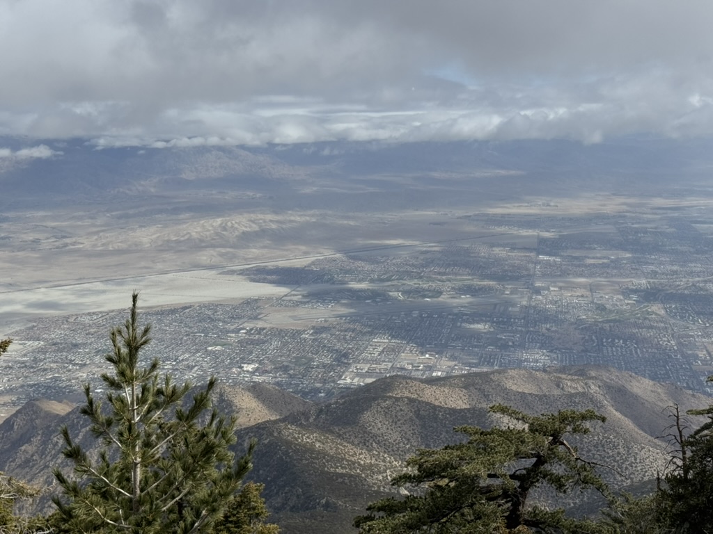Palm Springs airport visible from the peak — the runway as a tiny line on the valley floor