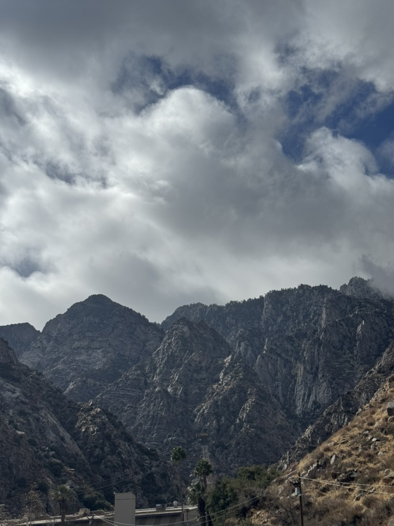 Stormy clouds spilling over the jagged cliffs of San Jacinto