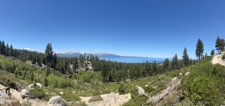 Afternoon panorama from the trail — Sierras snowcapped on the left, the lake stretching away on the right